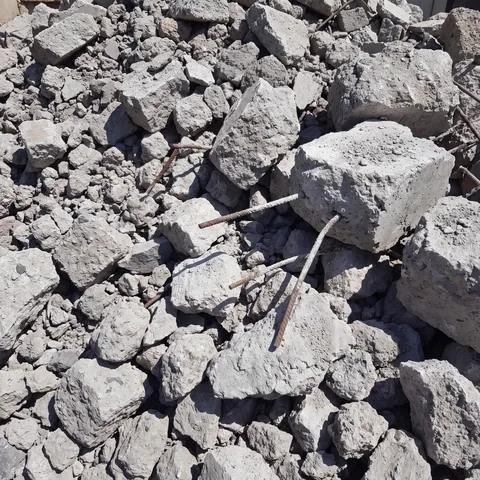 Pile of broken concrete chunks with rebar accepted for recycling in San Diego